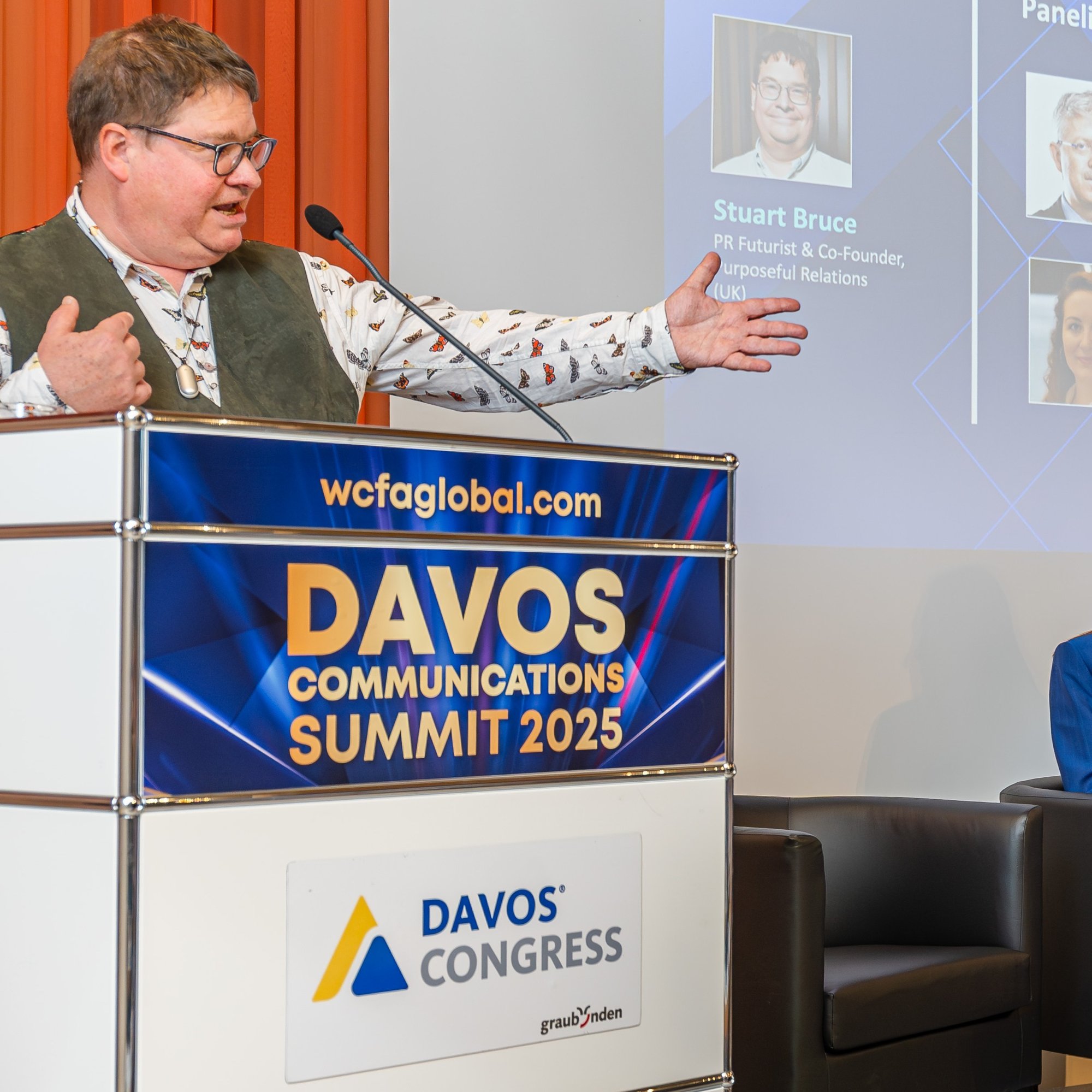 Stuart at Davos podium pointing